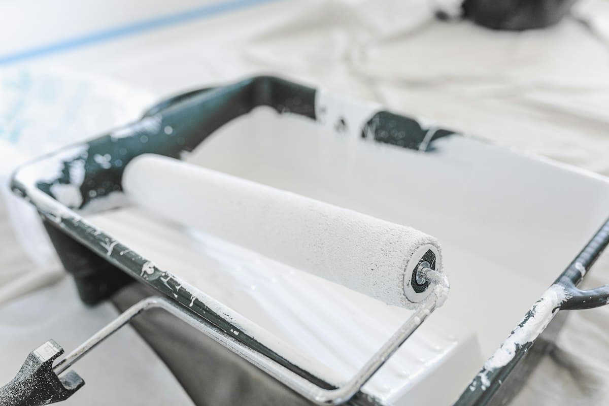 Paint roller and tray during an interior painting job
