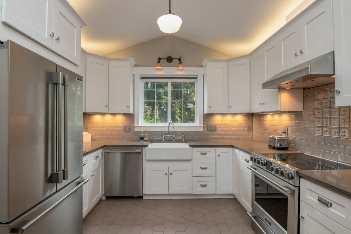 Bright remodeled kitchen with white cabinets