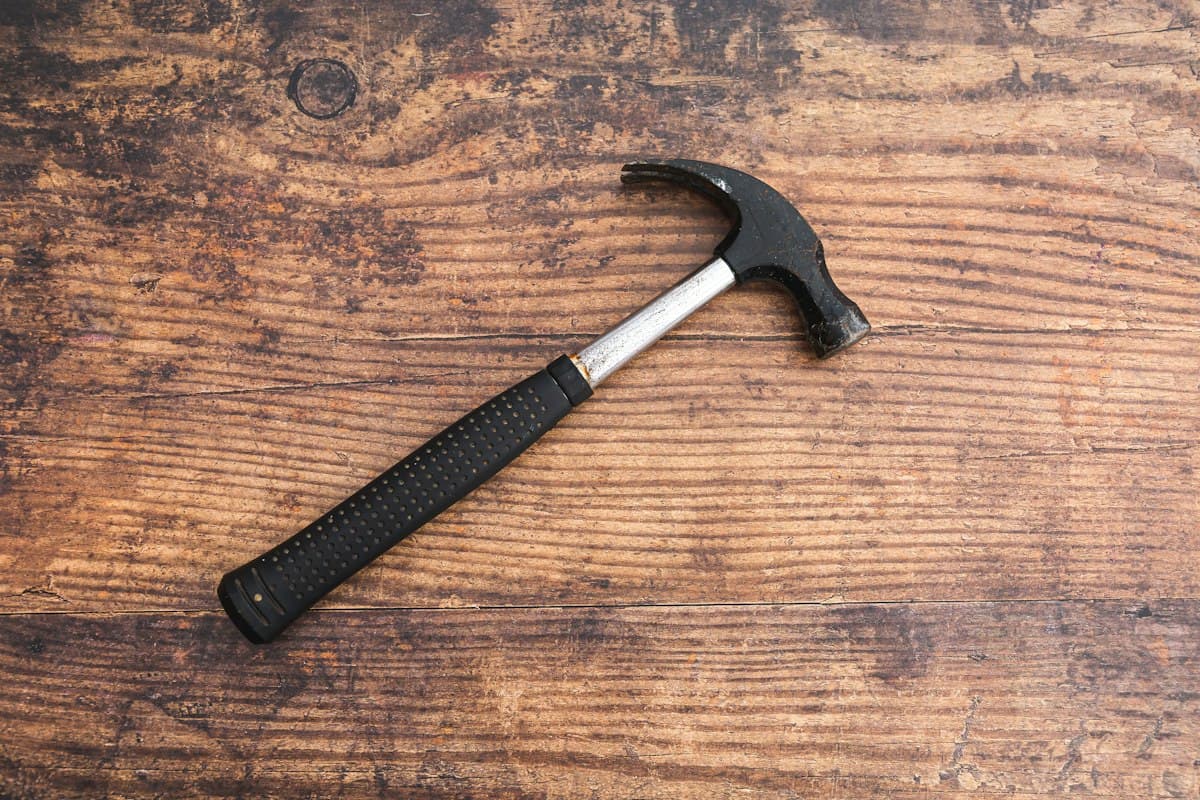 Claw hammer on a wooden workbench